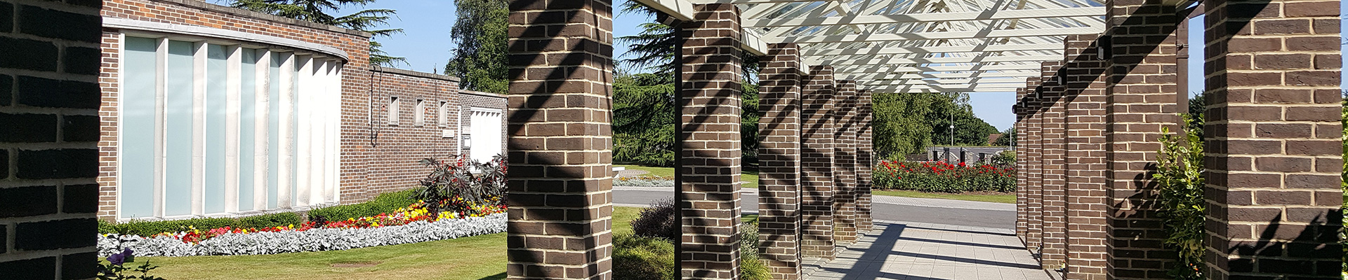 Photograph of a pillard walkway outside the main crematorium building